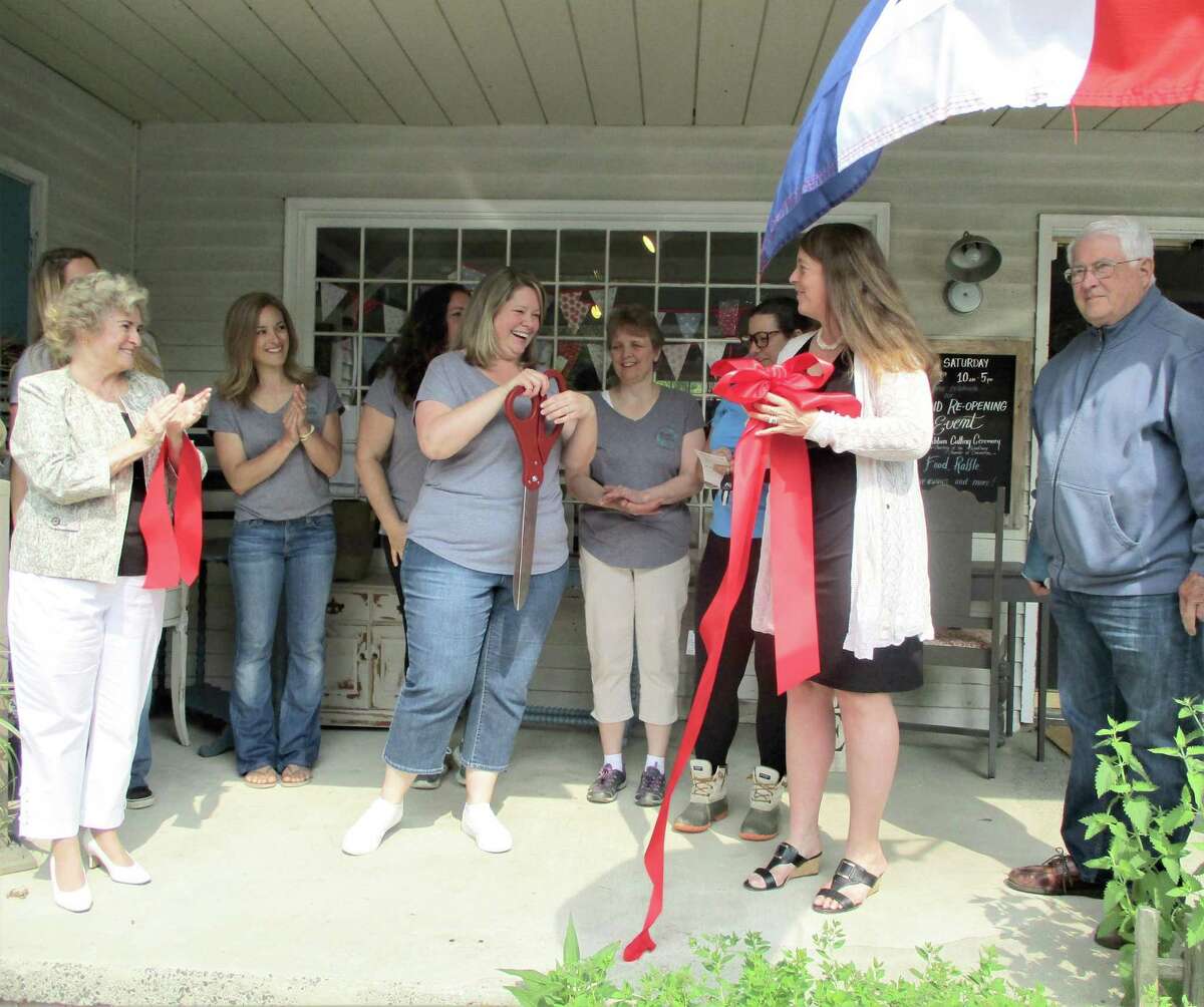 Charlotte Adams and her staff were joined by Woodbury First Selectman Barbara Perkinson, left, and Chamber of Commerce members President Karen Reddington-Hughes and Paul Luchetti, far right, for the ribbon-cutting ceremony.