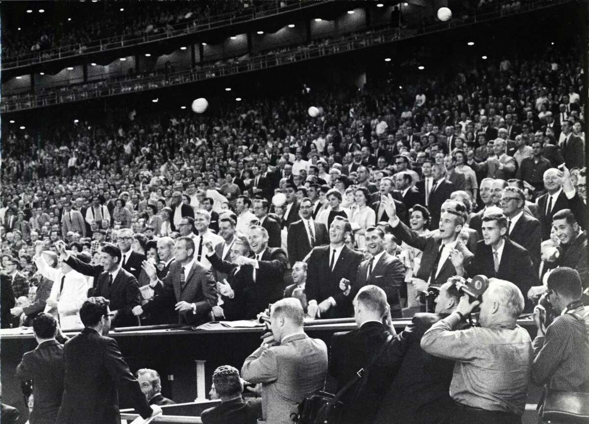 On April 12, 1965, 22 astronauts line up behind the Houston Astros dugout to throw out 'first balls' to the Astros who caught them and returned them to the spacemen. The astronauts were on hand that night to help the Astros launch the 1965 National League baseball season and officially open the $31.6 million Harris County Domed Stadium, which at the time was the world's only air-conditioned, all-weather baseball park.