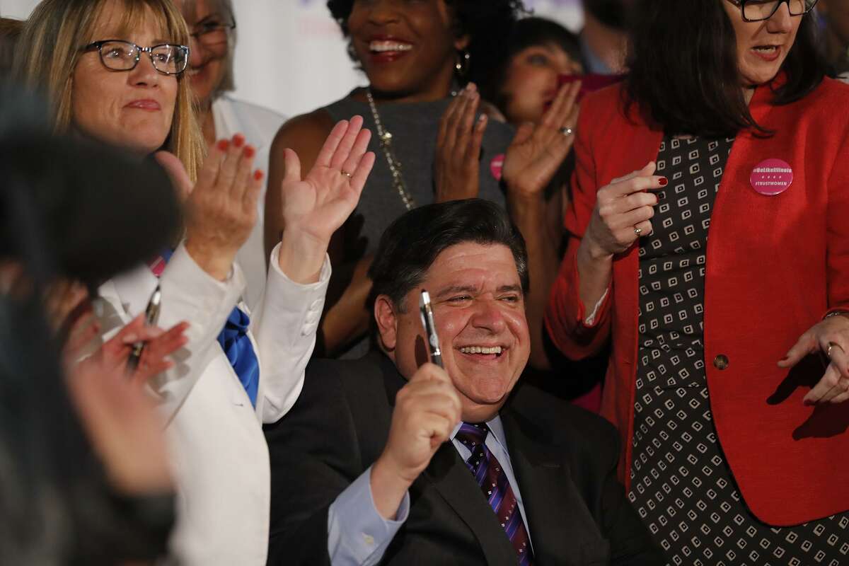 Illinois Gov. J.B. Pritzker signs the Reproductive Health Act into law June 12. The abortion debate has become red hot with even corporate CEOs signing on to the procedure as a fundamental right, what the Illinois law does.