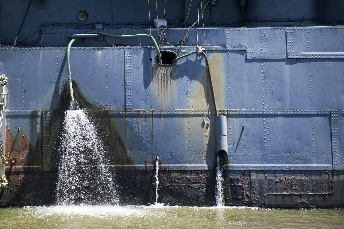 Water is pumped out of the hull of the Battleship Texas on Thursday, June 6, 2019, in La Porte. The U.S.S. Texas was part of the D-Day operations in Normandy and is the last remaining battleship to have served during the invasion. She also served during World War I.