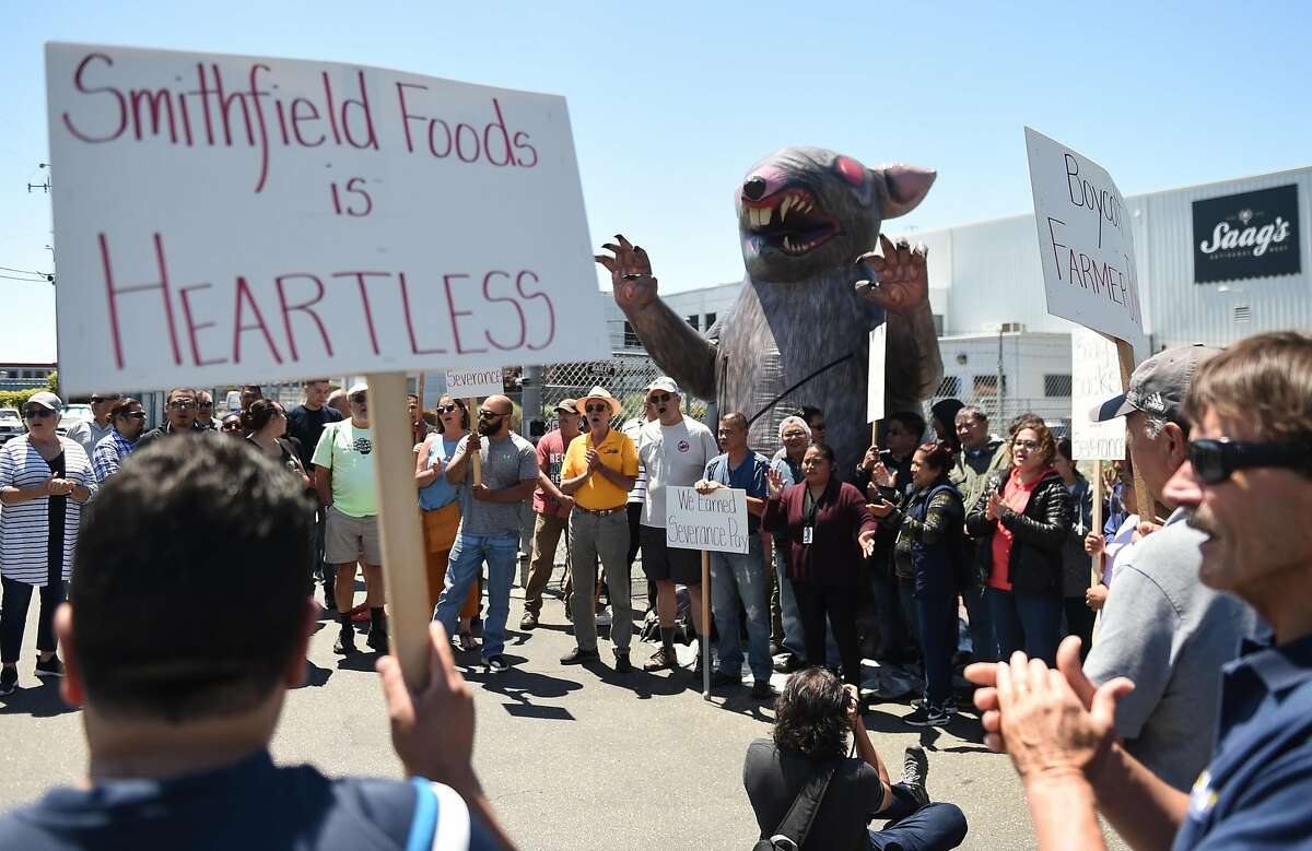 Laid-off workers and labor leaders march outside Saag's Specialty Meats in San Leandro, which is closing in two weeks, on Thursday June 14, 2019.