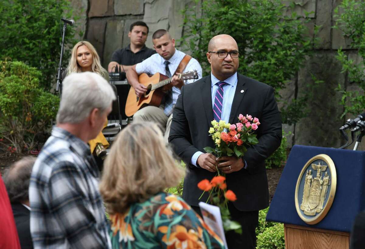 Albany County District Attorney David Soares stands near the podium to support family and friends of crime victims who came to pay tribute to fallen loved ones during the annual New York State crime victims dedication ceremony on Friday, June 14, 2019, at the Empire State Plaza in Albany, N.Y. (Will Waldron/Times Union)