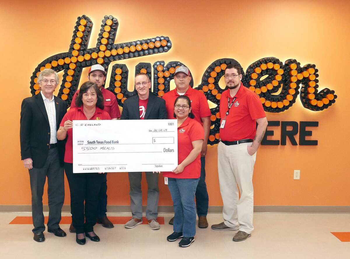 Representatives from C. R. England, a global trucking company, presented a check to cover 5,500 meals to the South Texas Food Bank on Friday.