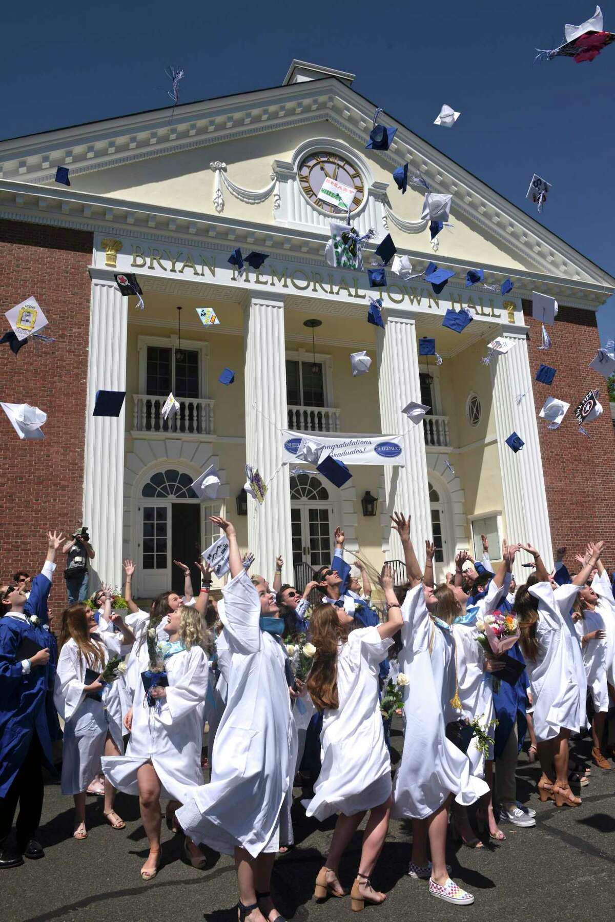 The graduates throw their caps in the air after the Shepaug Valley High School Class of 2019 Commencement, Saturday morning, June 15, 2019, on the Bryan Memorial Town Hall lawn, Washington, Conn.
