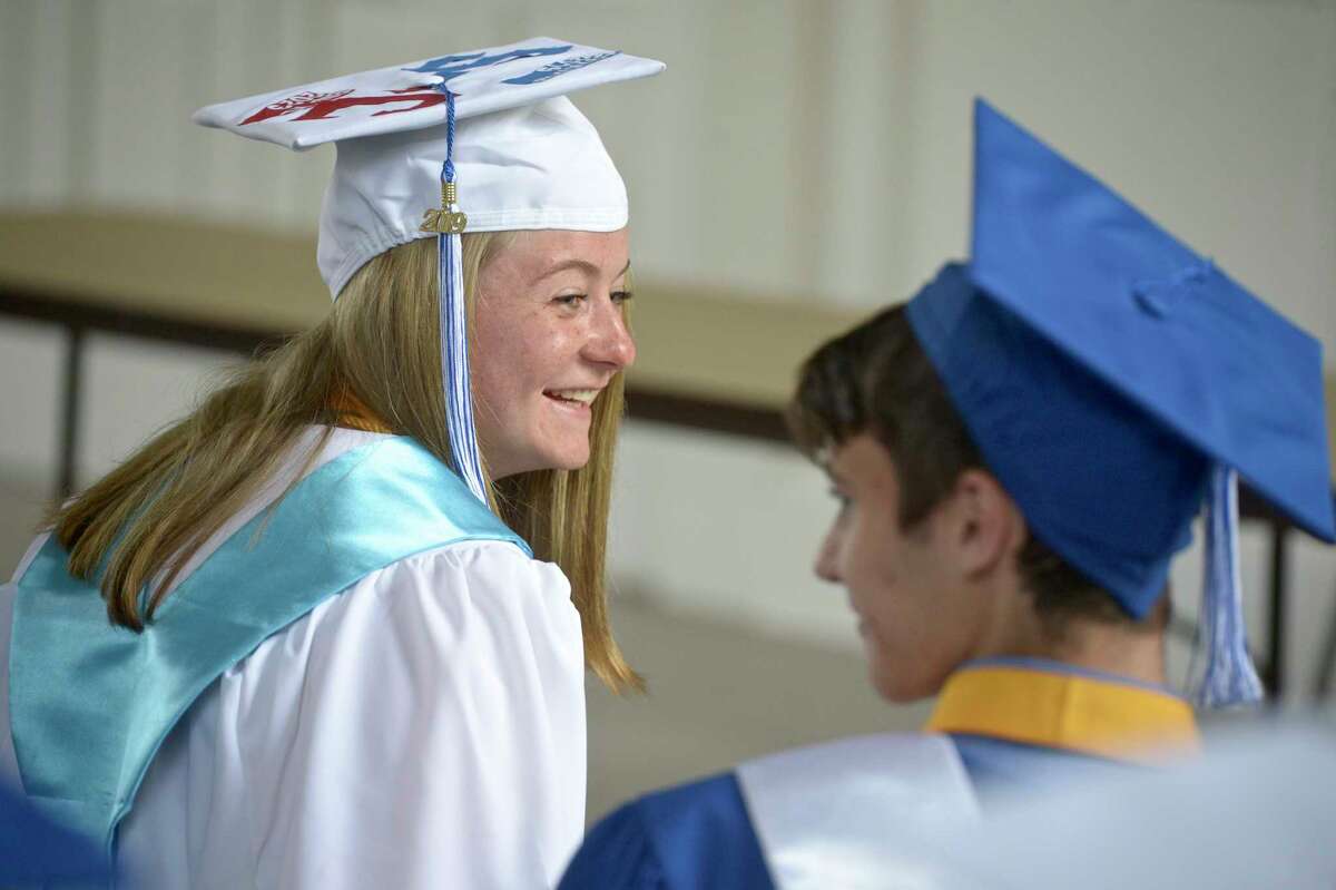 Abigail Lela Gorra, of Washington, talks with class mates before the Shepaug Valley High School Class of 2019 Commencement, Saturday morning, June 15, 2019, on the Bryan Memorial Town Hall lawn, Washington, Conn.