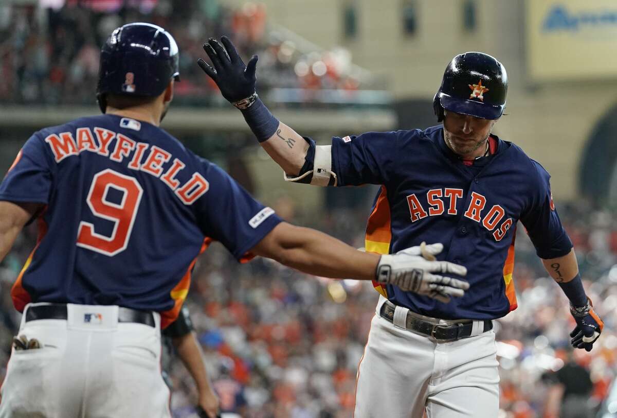 Houston Astros' Josh Reddick gestures after hitting a double