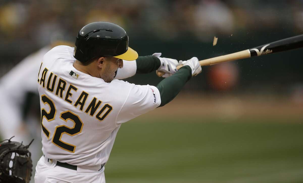 Oakland Athletics' Ramon Laureano swings for a two-run single off Seattle Mariners' Gerson Bautista in the first inning of a baseball game Saturday, June 15, 2019, in Oakland, Calif. (AP Photo/Ben Margot)