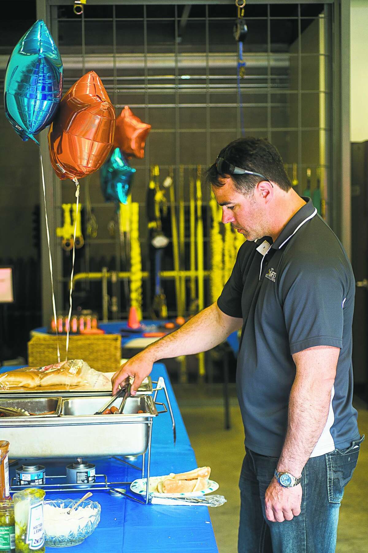 Guests enjoy lunch during a 30th anniversary celebration for the Great Lakes Safety Training Center on Wednesday, June 12, 2019 at the facility in Midland. (Katy Kildee/kkildee@mdn.net)