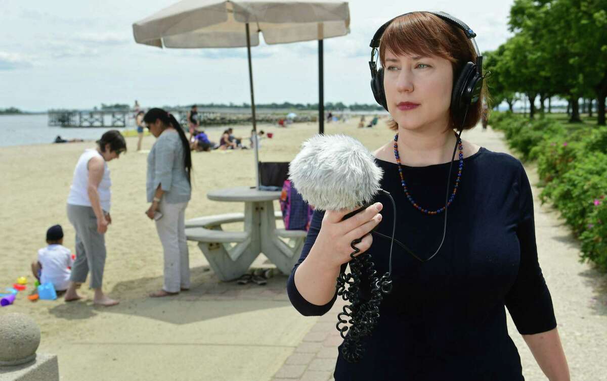Board of Education member Sarah Lemieux at Calf Pasture Beach Wednesday, June 12, 2019, in Norwalk, Conn. Lemieux has spent the past several months created a mixed-media audiovisual installation that will be exhibited at the Rene Soto Gallery beginning in July. She traveled around the city collecting sound bytes from people saying "We Are Norwalk," which she then edited together and overlayed with visuals of the corresponding neighborhoods and landmarks in Norwalk where the sounds were collected.