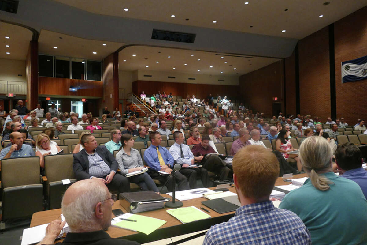 More than 150 residents turned up at in East Ridge Middle School Tuesday night to attend the first public hearing on the proposed Ridgefield Winter Club. There are four more hearings scheduled. No members of the public were able to speak as the hearing was continued during the applicant's lighting presentation. - Steve Coulter photo