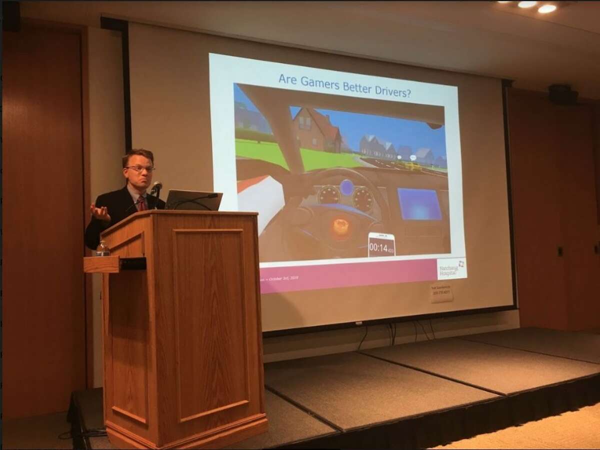 Dr. Paul Weigle discusses video game addiction to a crowd of about 80 parents at the library on Oct. 3. - Peter Yankowski photo