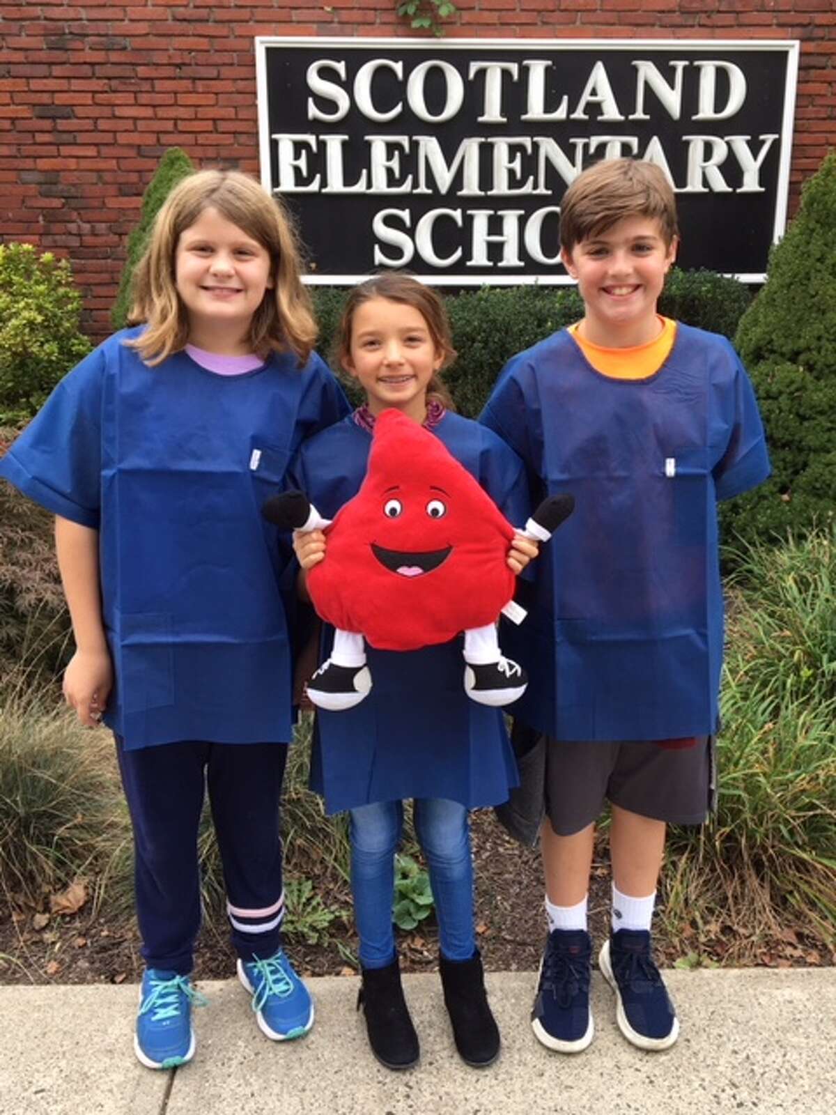 Scotland Elementary School fifth graders, from left to right, Grace Gordon, Juliette Arencibia, Daniel Petersen will be hosting the schools sixth annual blood drive Thursday, Oct. 25.