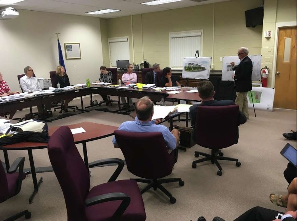 Ray Sullivan, of The Sullivan Architectural Group, presents developer Marty Handshy's plan to build a 30-unit apartment building at 233 Danbury Road to the Planning and Zoning Commission. The project would include affordable housing units under the state's 8-30g law. The town's four-year moratorium on 8-30g developments ends on Oct. 7. - Peter Yankowski photo