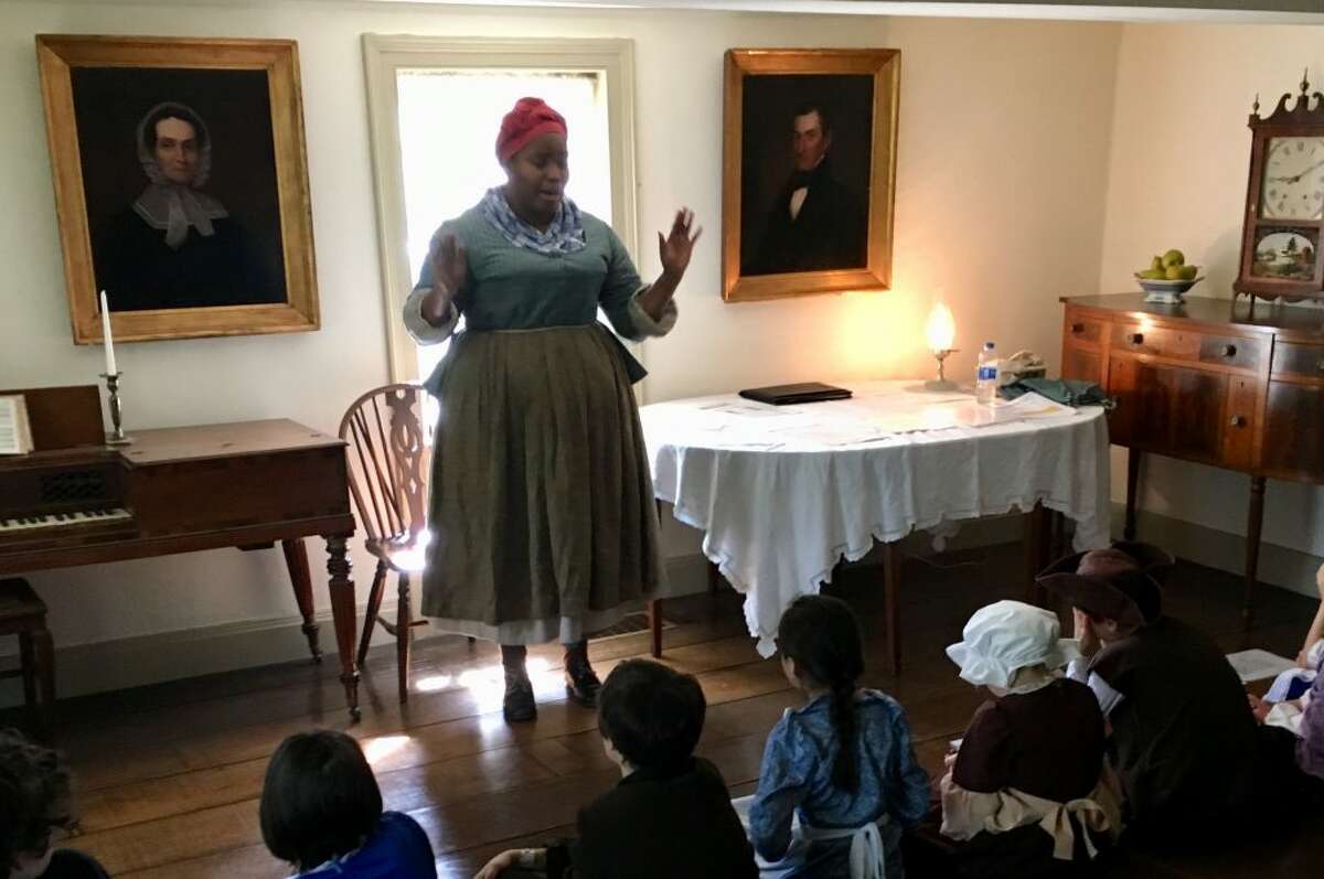 Cheyney McKnight, pictured as a historical interpreter during the Keeler Tavern Museum’s #HandsOnHistory Month, will give a talk the headwraps of African women in America Sunday, Oct. 7.