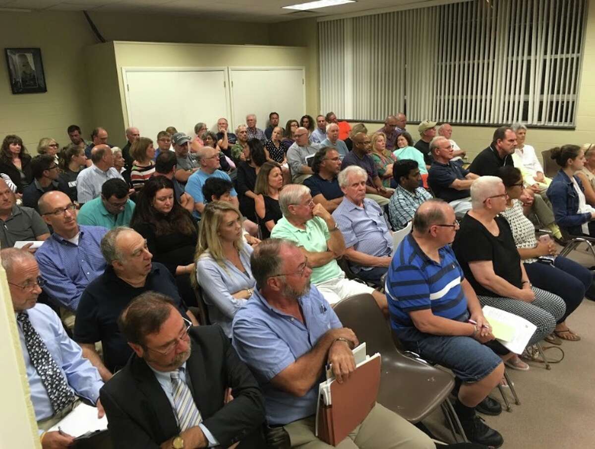 Residents crowded into the town hall annex on Wednesday, Sept. 19, for two back-to-back public hearings — one for a pond-dredging home business on Clearview Drive, and another for an affordable housing apartment building on Danbury Road. — Peter Yankowski photo