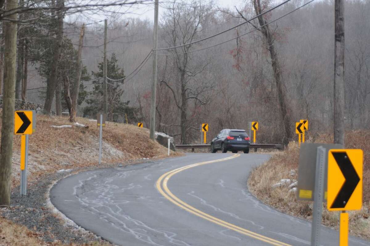 A multitude of arrow signs were put up to help drivers negotiate the big curve on Old Stagecoach Road. — Macklin Reid photo