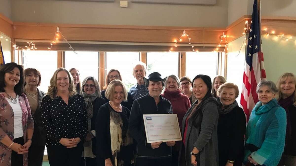 Beverly Fairchild, center, Coldwell Banker Ridgefield sales office vice president and managing broker, stands with Marge Lanzara, Lisa Pompeo, Susan Bryant, Margi Esten, Marilyn Sloper, Donna DiBartolo, Ira Stone, Millicent Good, Deb Haws and Angelica Fontanez, Redding director of human services. Also pictured: Peri Bartro, Sharon Hoverman, Grace Fuschetto and Wendy Anderson.