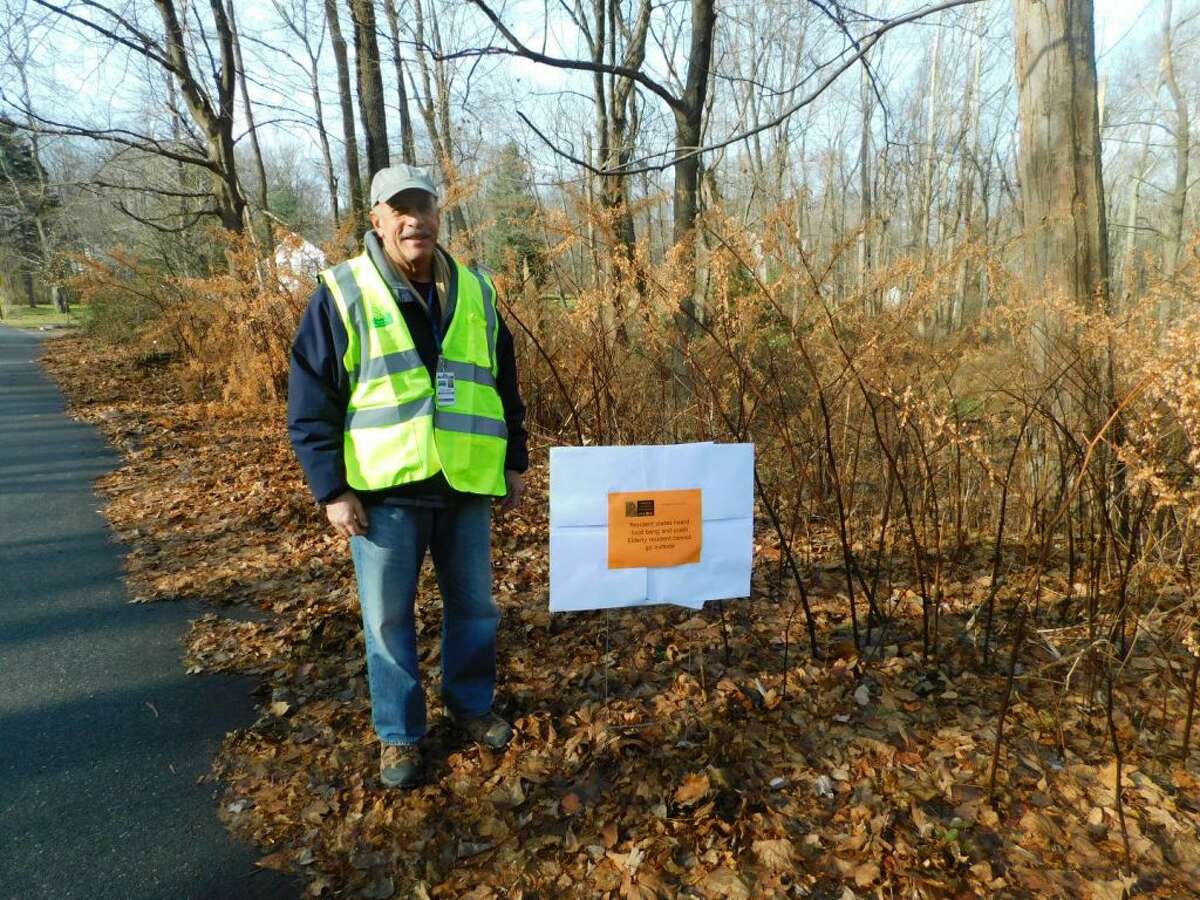 CERT volunteer Roger Rostaino identifies one of the signs placed around town on Dec. 2 as volunteers test Crises Track, a program that will help identify and prioritize damage particularly during a storm.