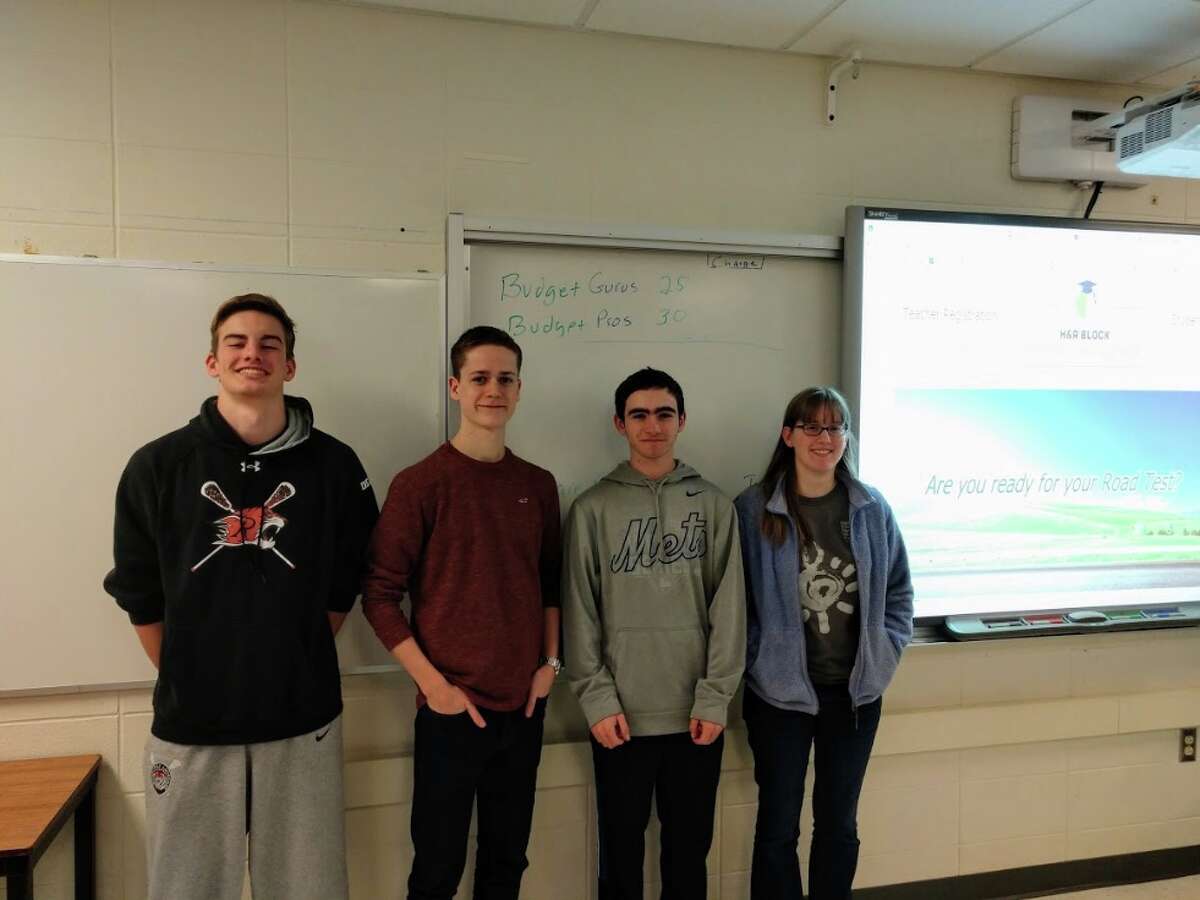 Budget Challenge winners at Ridgefield High School, from left to right: Ray Dearth, RJ Carey, Bobby Arent and Amy Smart.