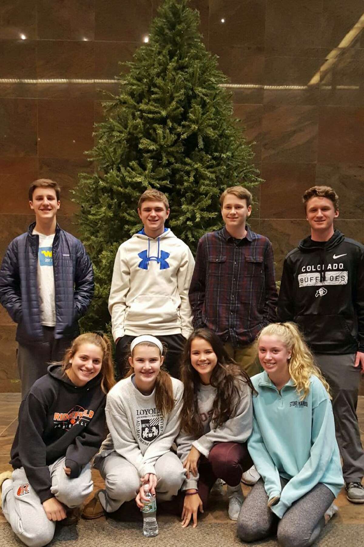 Pictured, in back from left to right are: Full Court Peace members: Finn Atkins, Evan Collins, Sean Maue, and Jason Hartnett. In front, from left to right: Jamie Narcisso, Katie Flynn, Rachel Tomasetti and Kate Garson.