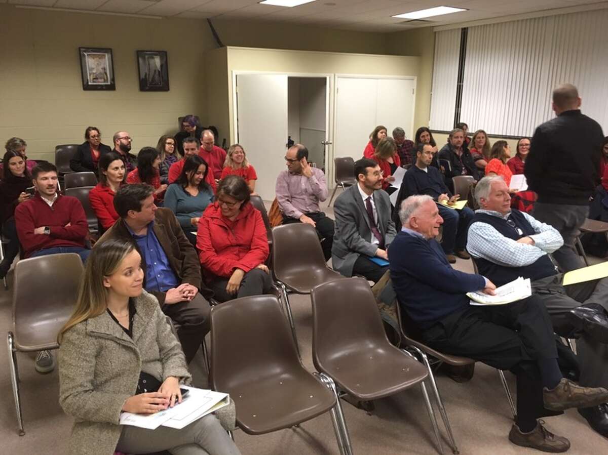 Parents and residents against the start school later initiative turned up at Monday night's Board of Education meeting wearing red clothing. Six people spoke, all of them in opposition to the plan. - Peter Yankowski photo