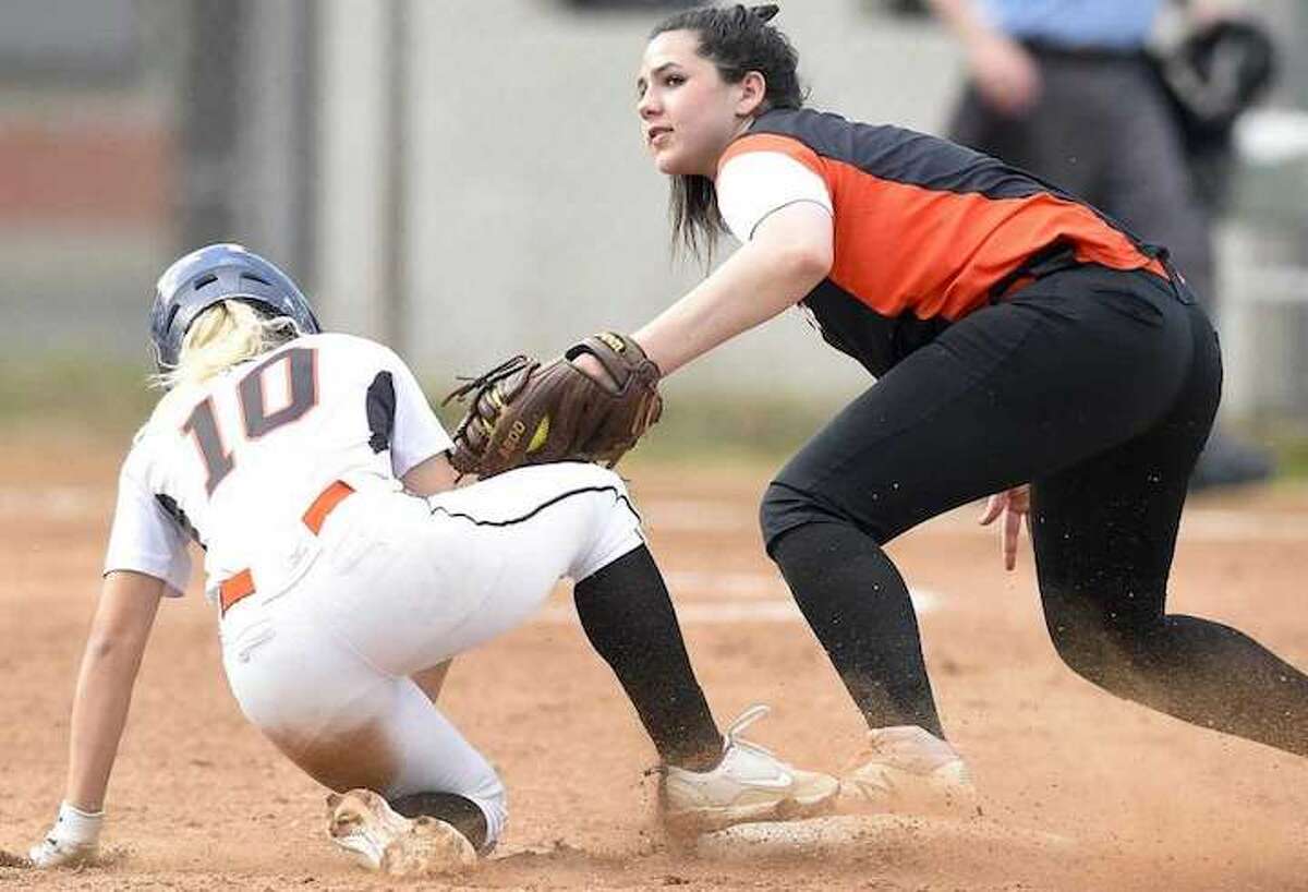 Ridgefield's Sabrina Grizzaffi is late with the tag on Stamford's Brycelin Stalteri during a play at second base in Friday's FCIAC quarterfinal game at Stamford High School. - Matthew Brown / Hearst Connecticut Media
