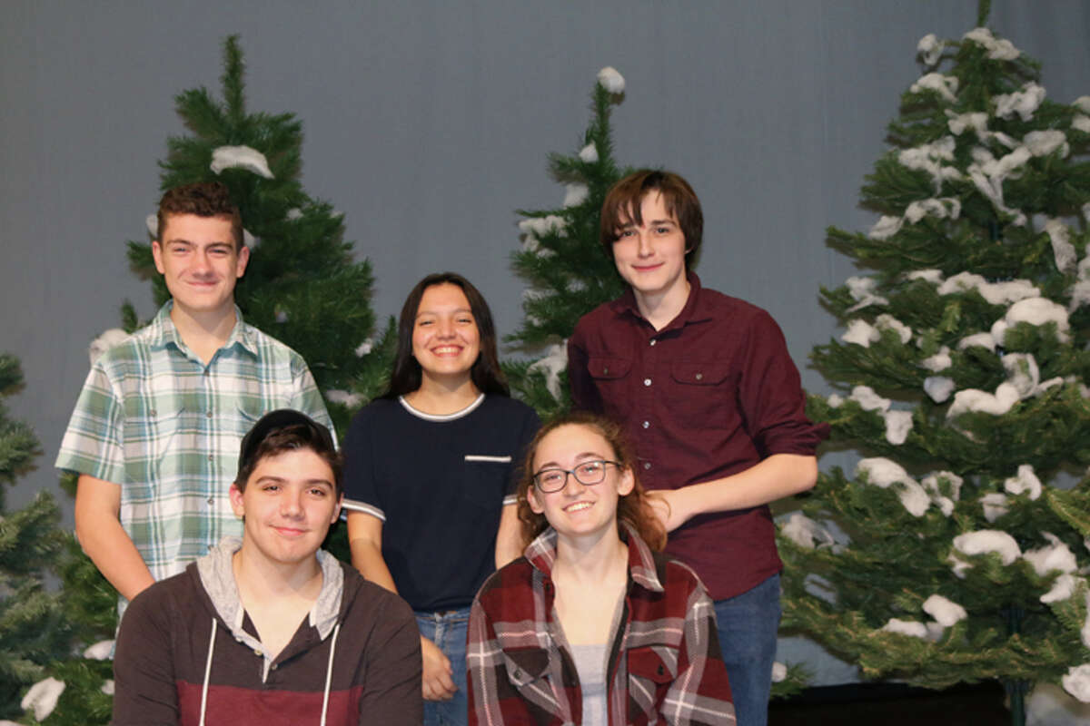 The lighting crew of the RHS production of Almost, Maine stands with trees being readied for the show's pine forest. Front row, left to right: DJ Ammirato and Emma Jaeger. Back row: Jonah Pereyra, Anna Sorgie and Dennis Dowding. - Tanya Jaeger photo
