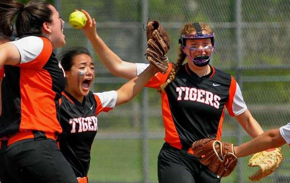 The Ridgefield High softball team celebrates its win over West Haven in the second round of the Class LL state tournament. — Christian Abraham / Hearst Connecticut Media