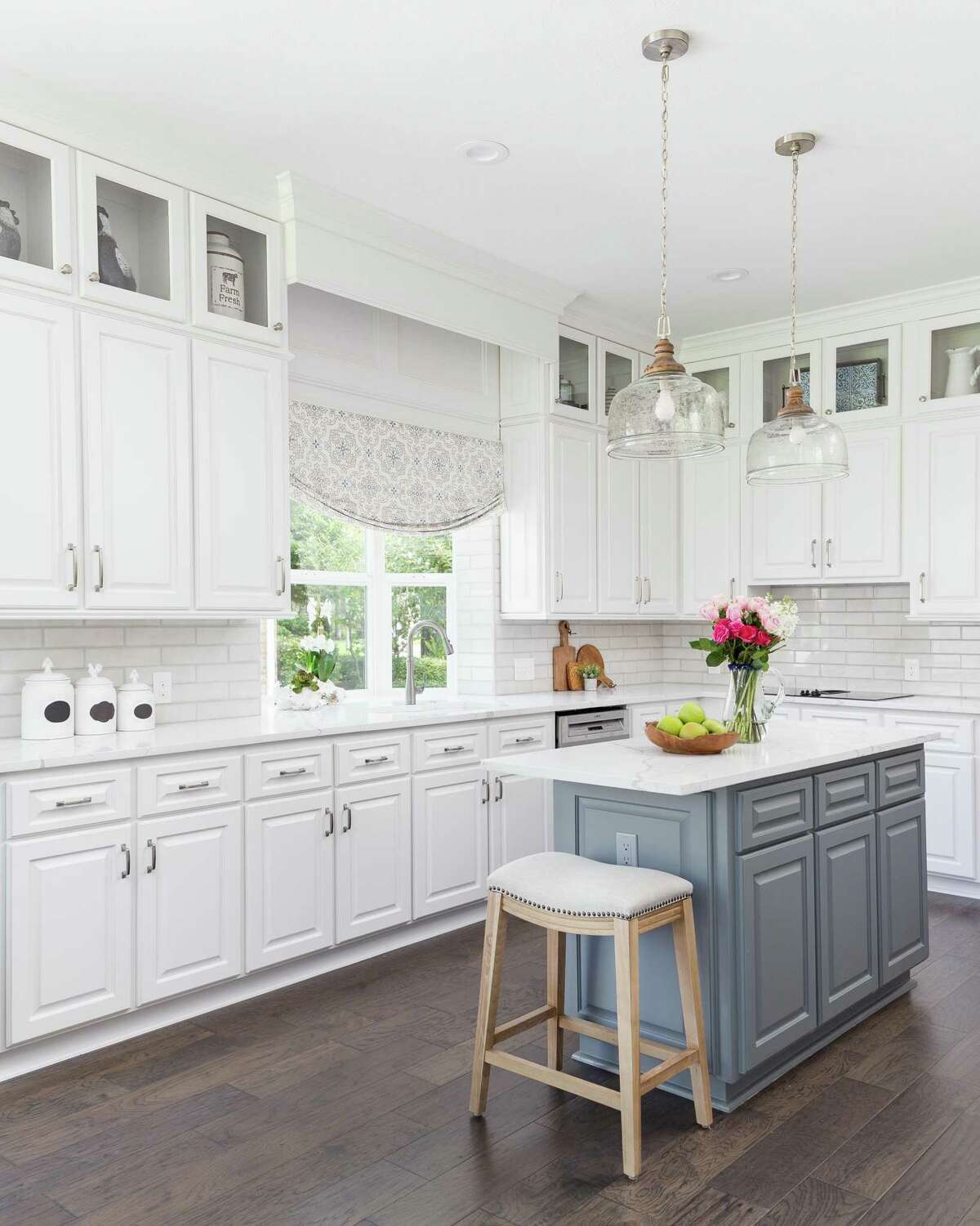 Beth Clark’s kitchen used to be full of beige. A renovation made it lighter and brighter in transitional style.