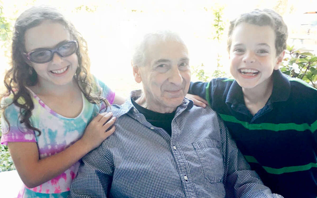 Stan Strauss with his grandchildren, Cate and Jake.