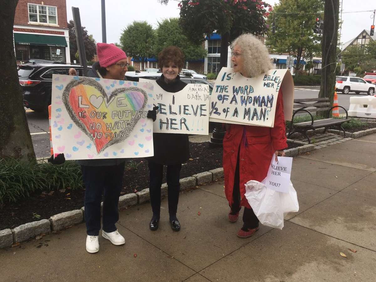 Ridgefield residents Alisa Trachtenberg, Kelly Breckinridge, and Suzanne Benton protest Judge Brett Kavanaugh's nomination to the Supreme Court on Main Street Friday, Sept. 28. - Peter Yankowski photo