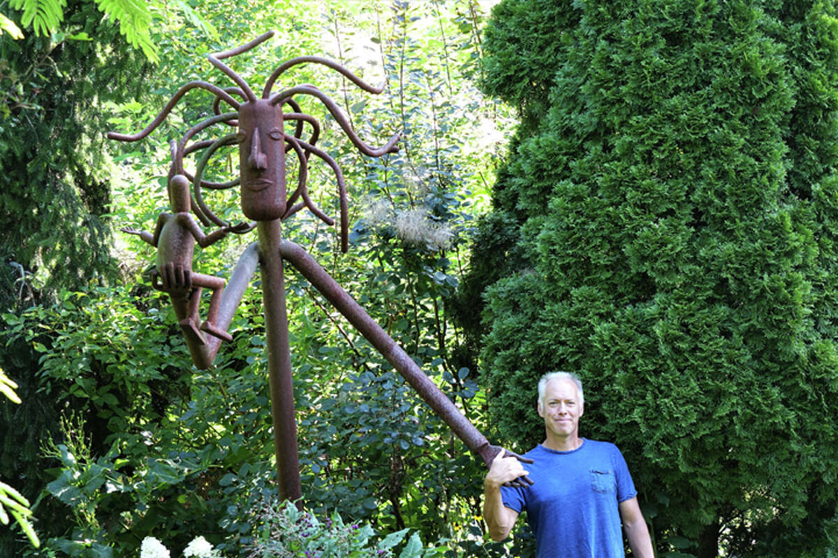 Joe Keller stands in the Garden of Ideas, which started on the small residential property where Keller grew up, learning gardening — and the love of it — from his mother, Terry Keller. Joe has launched a campaign to raise $1 million, which he believes can make a self-sustaining operation there.