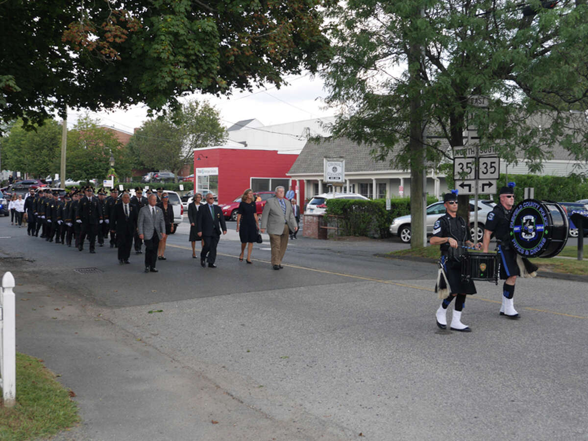 A procession before the wake of Ridgefield Police Chief John Roche closed down part of Catoonah Street Thursday afternoon. More traffic is expected on Catoonah and other village roads following the chief's funeral at 10:15.— Peter Yankowski photo