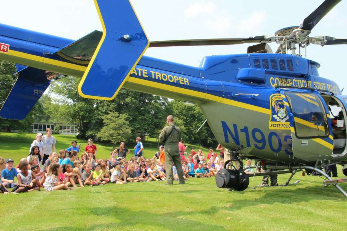 Trooper 1 pilots talk to Boys and Girls Club campers at Veterans Park Thursday afternoon. — Tauna Idone photo
