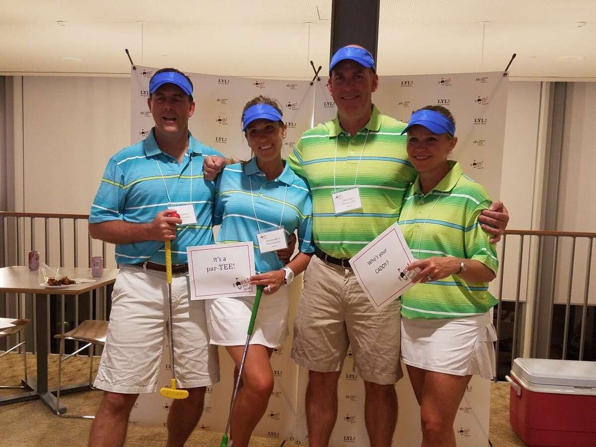 Mike Atkins, Andrea Atkins, Chris Grant and Amanda Grant at last year’s FORE! your library Mini-Golf Challenge Cup Tournament.