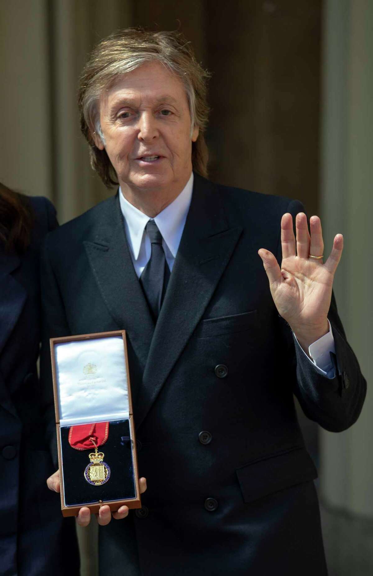 British musician Paul McCartney poses with his medal after an investiture ceremony at Buckingham Palace in London where was made a Companion of Honour on May 4, 2018. / AFP PHOTO / POOL / Steve ParsonsSTEVE PARSONS/AFP/Getty Images
