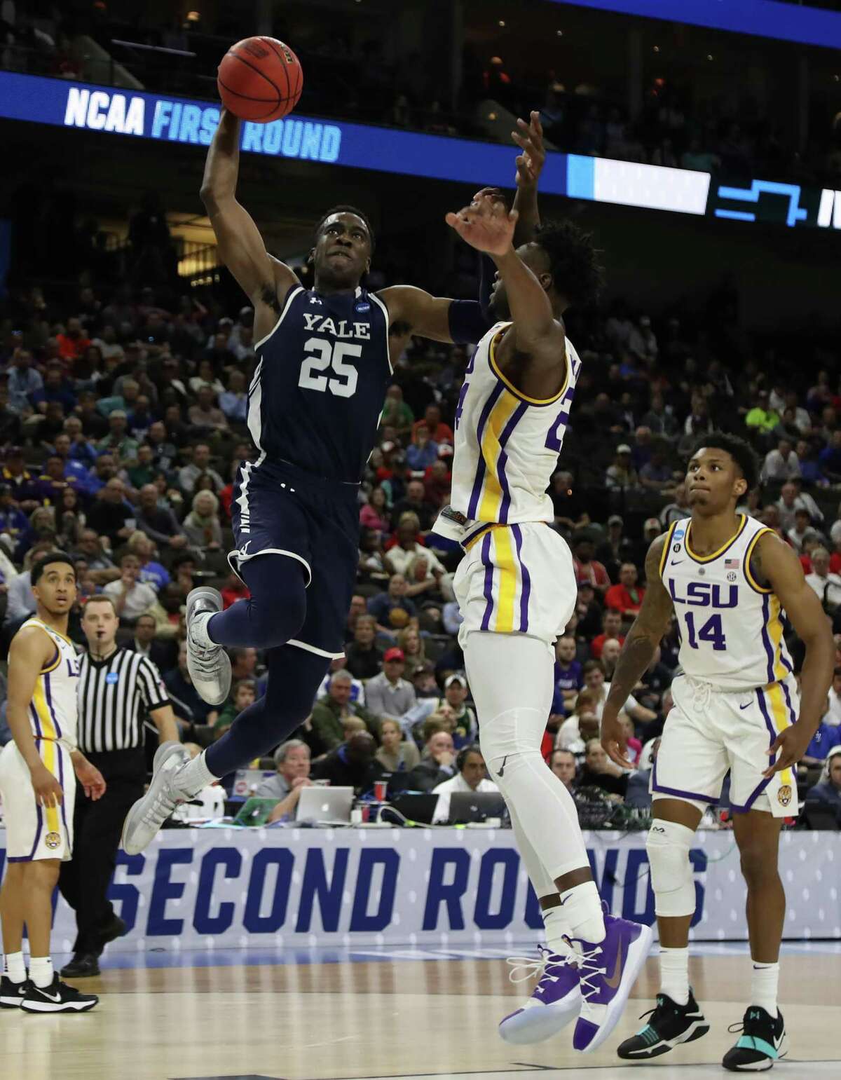 Yale’s Miye Oni (25) takes a shot against LSU’s Emmitt Williams (24) during the first round of the NCAA Men’s Basketball Tournament at VyStar Jacksonville Veterans Memorial Arena on March 21in Jacksonville, Fla.