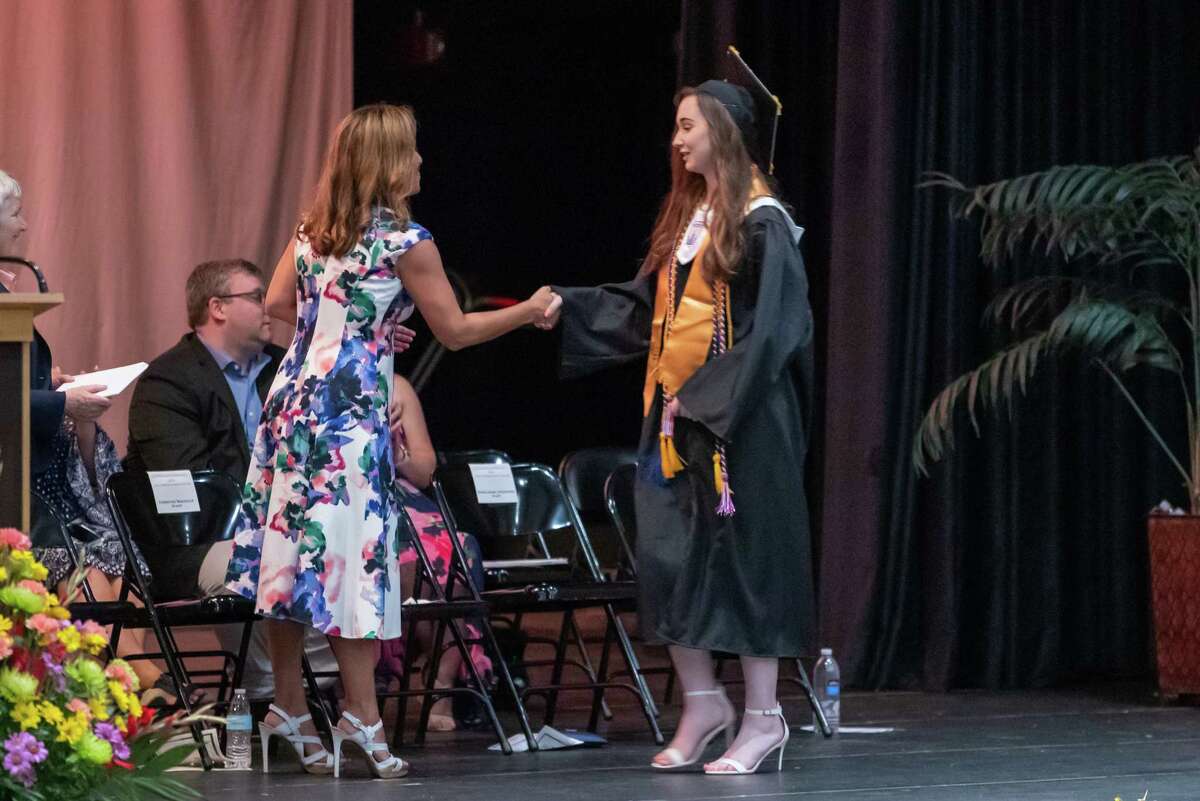 Faculty greet and congratulate graduating seniors at the graduation for the class of 2019 for the Academy of Information Technology & Engineering on June 17, 2019 at the Rippowam Auditorium in Stamford, CT.