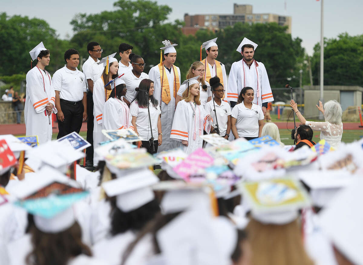 The Madrigal Singers and Concert Choir members perform at the Stamford High School Graduation in Stamford, Conn. on Monday, June 17, 2019.