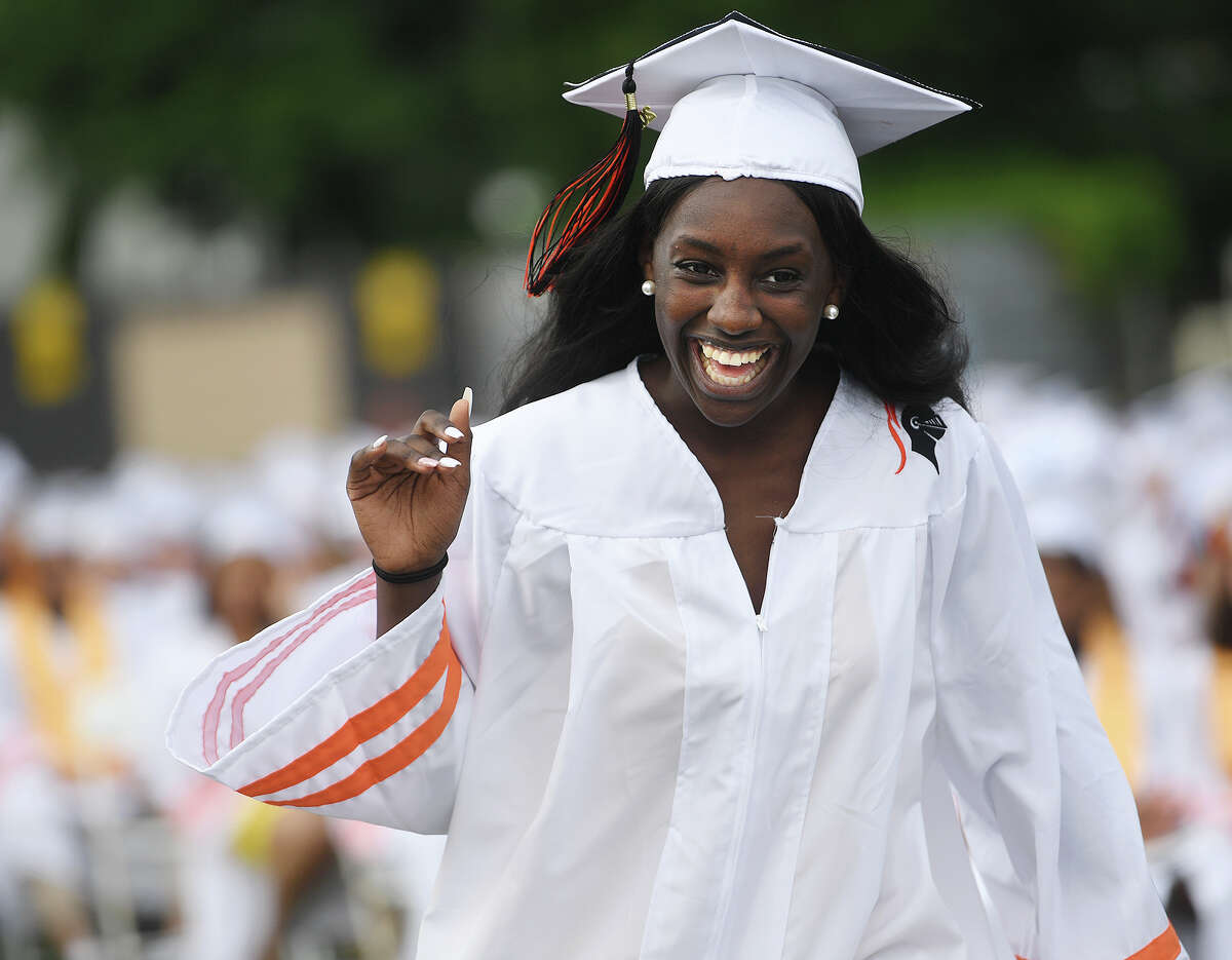 Graduate Kymani Bailey is all smiles as she walks up to receive her diploma at the Stamford High School Graduation in Stamford, Conn. on Monday, June 17, 2019.