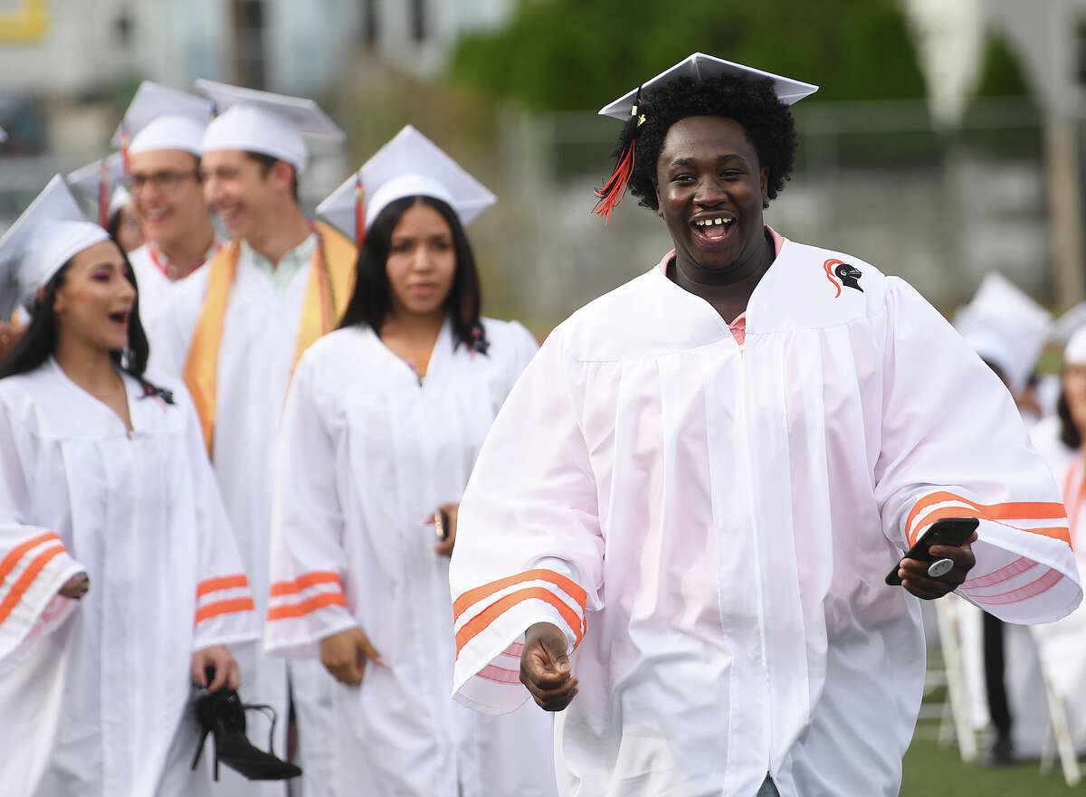 Graduate Khamar Brown breaks into a big smile as he walks up to receive his diploma at the Stamford High School Graduation in Stamford, Conn. on Monday, June 17, 2019.