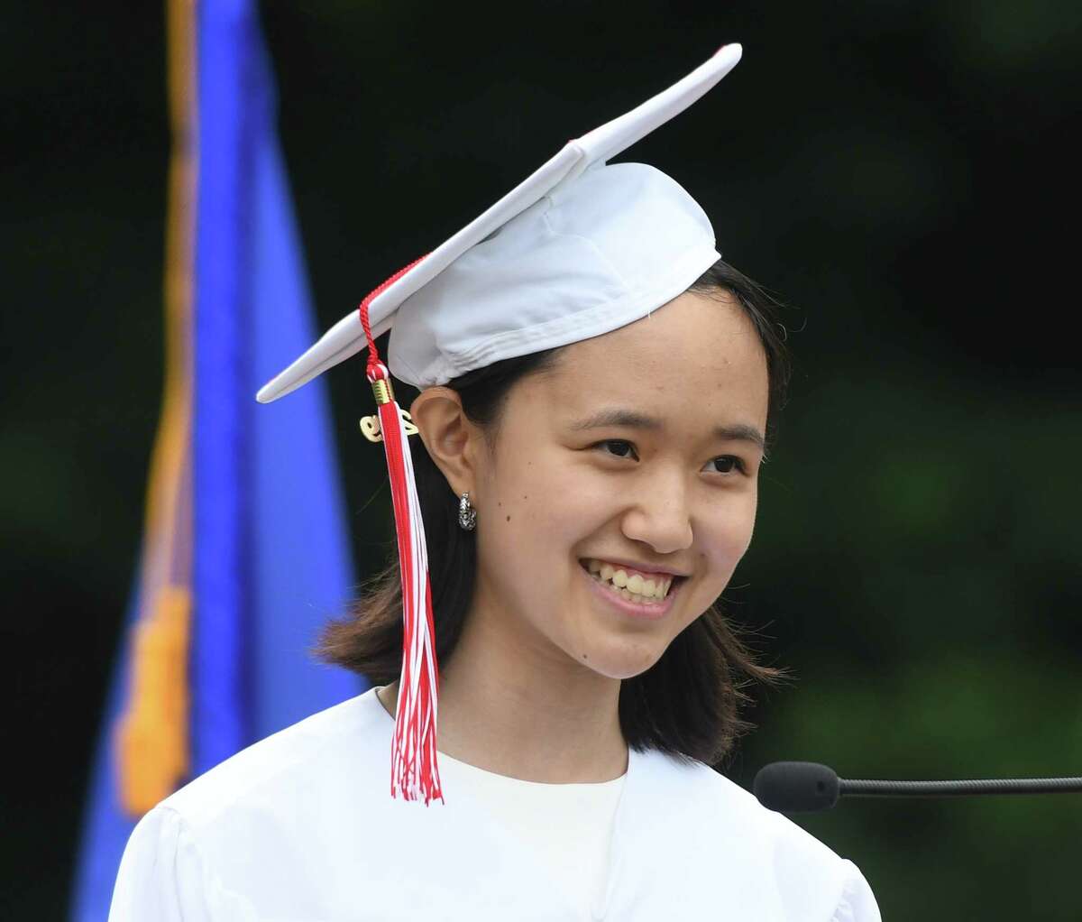 Co-Valedictorian Jovita Li speaks at the 2019 Graduation at Greenwich's High School's Cardinal Stadium in Greenwich, Conn. Monday, June 17, 2019. Emmy-winning musician and composer Rob Mathes, GHS Class of 1981, delivered the commencement speech as 677 students received their diplomas.
