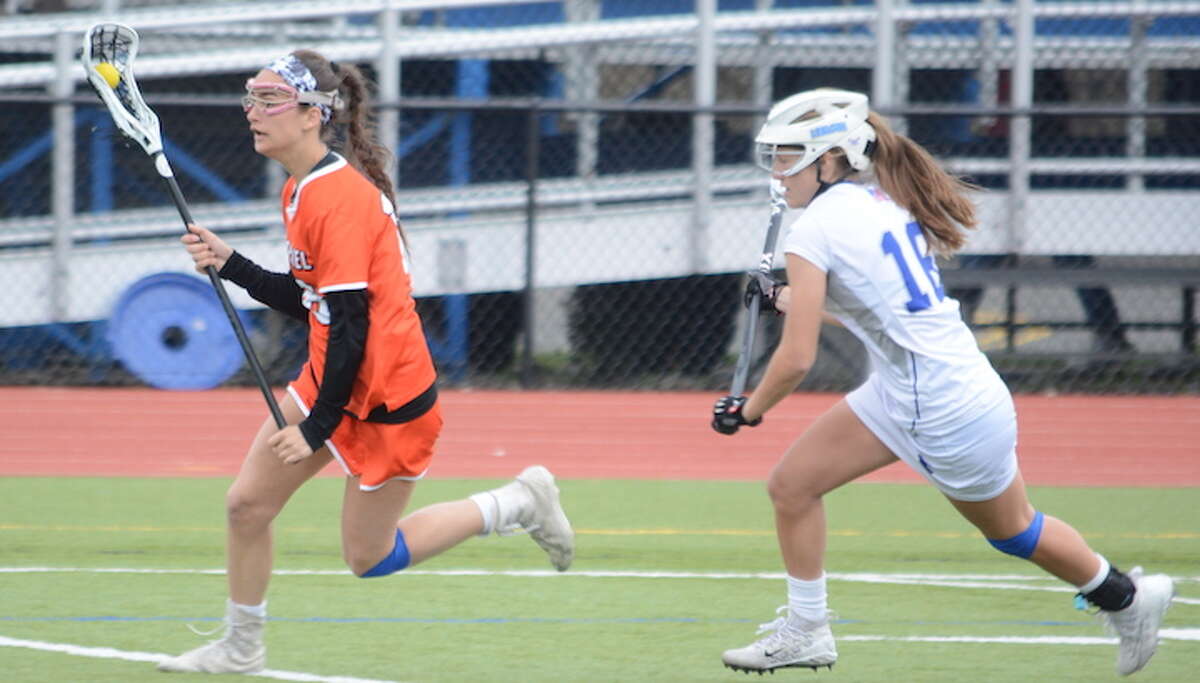 Aly Gagnon is pursued by a Ludlowe defender during Saturday's game. — Andy Hutchison photo