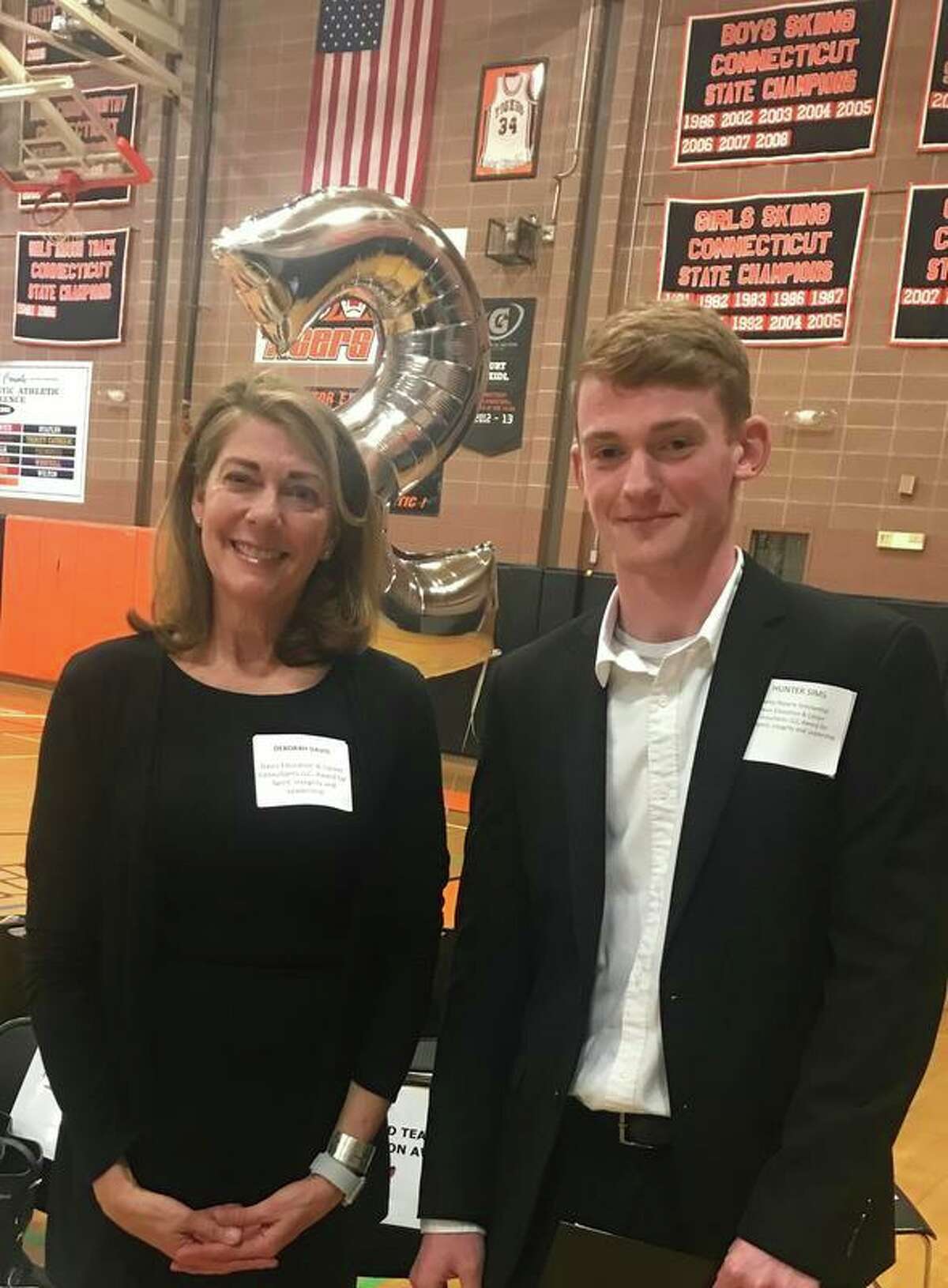 Deborah Davis, president of Davis Education and Career, with Ridgefield High School senior Hunter Sims. Sims, a talented jazz musician, was chosen as Davis' 2019 scholarship recipient based on academics, integrity, leadership and spirit. He will be attending the University of North Texas in the fall.
