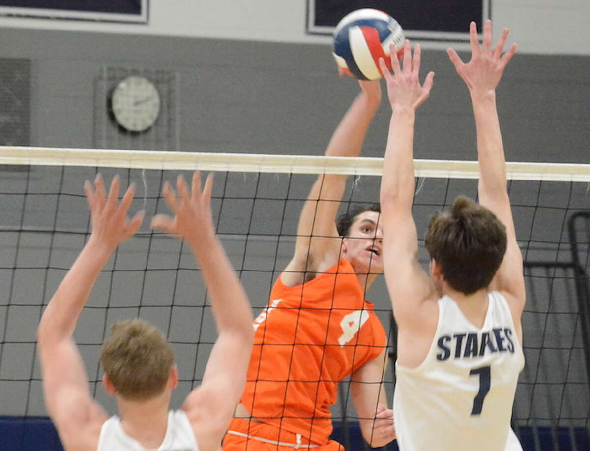 Andrew Masciotti goes for a kill in Monday's match with Staples. — Andy Hutchison photo