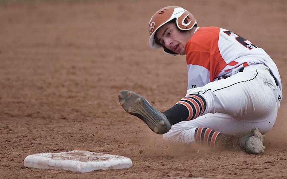 Cole Blackwell slides into third base during Ridgefield's 5-1 win over Weston. — Scott Mullin photo