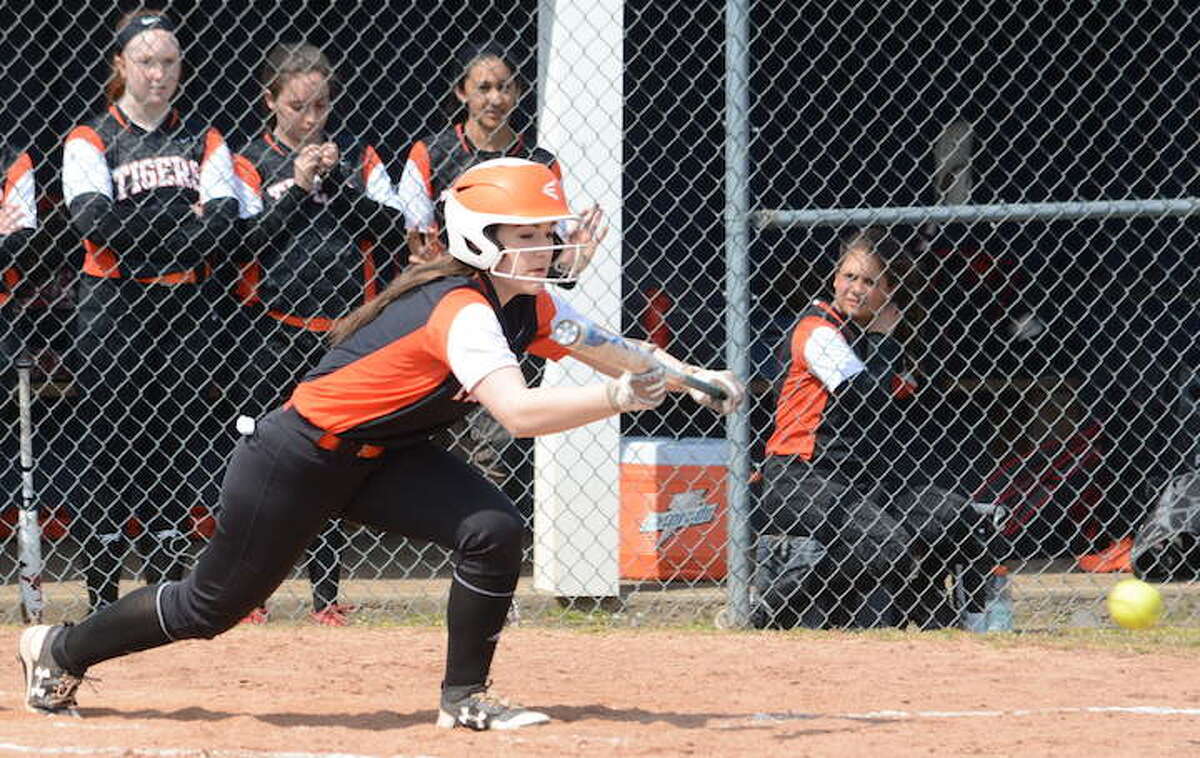 Claire Filaski lays down a bunt during Ridgefield's season opener against Staples. - Andy Hutchison photo