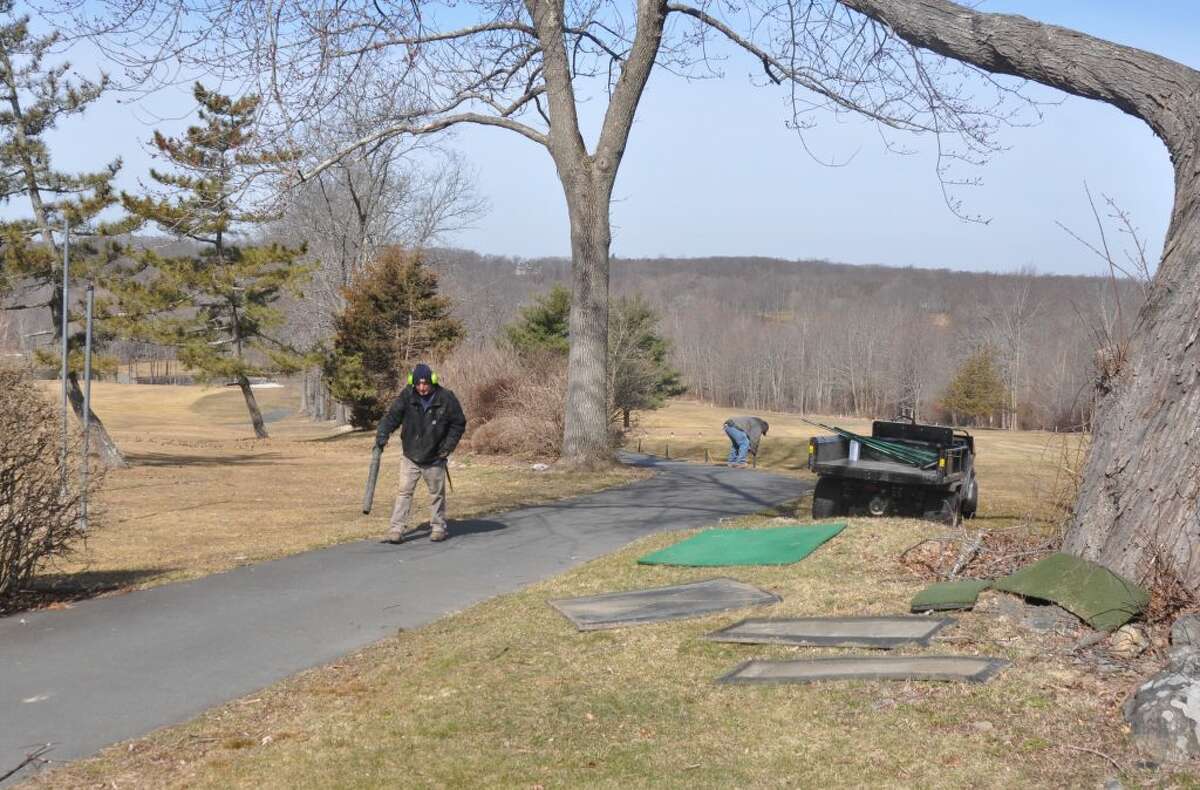 Workers were out Thursday morning readying the Ridgefield Golf Course for its spring opening Friday, March 29, 2019. — Macklin Reid/Hearst Connecticut Media