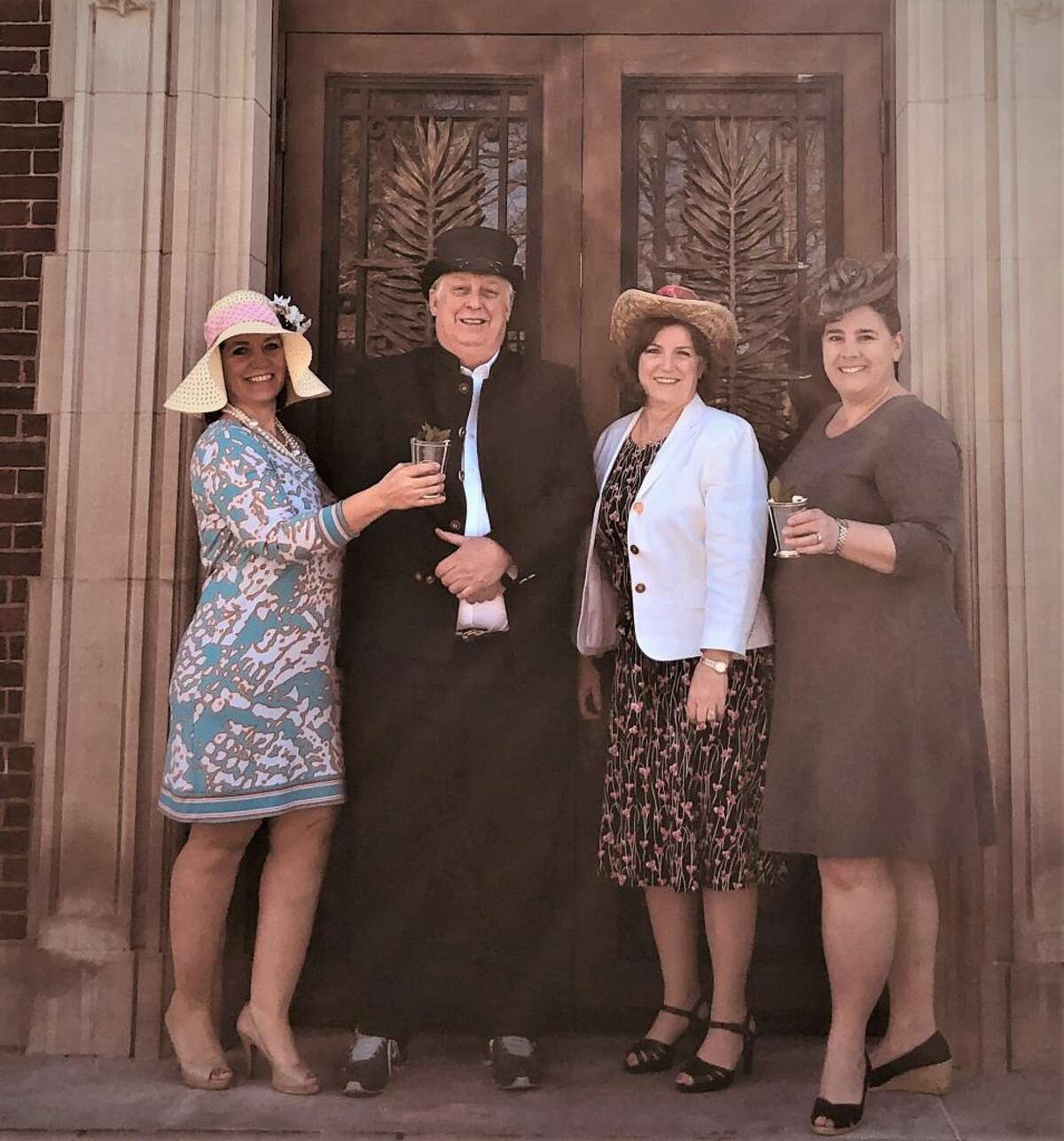 The Ridgefield Library will be hosting a Kentucky Derby-themed gala. Committee members, from left to right, Michele Booth, Rob Ellis, Julie Yaun and Lynn Everdell prepare for the 145th Run for the Roses by donning derby-inspired outfits in front of the library.