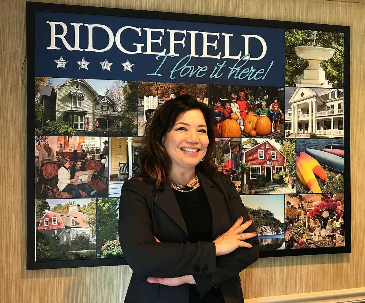 Kim Bova, new executive director of the Ridgefield Chamber of Commerce, stands in the organization's office in Ridgefield, Conn., on Thursday, Oct. 11, 2018.